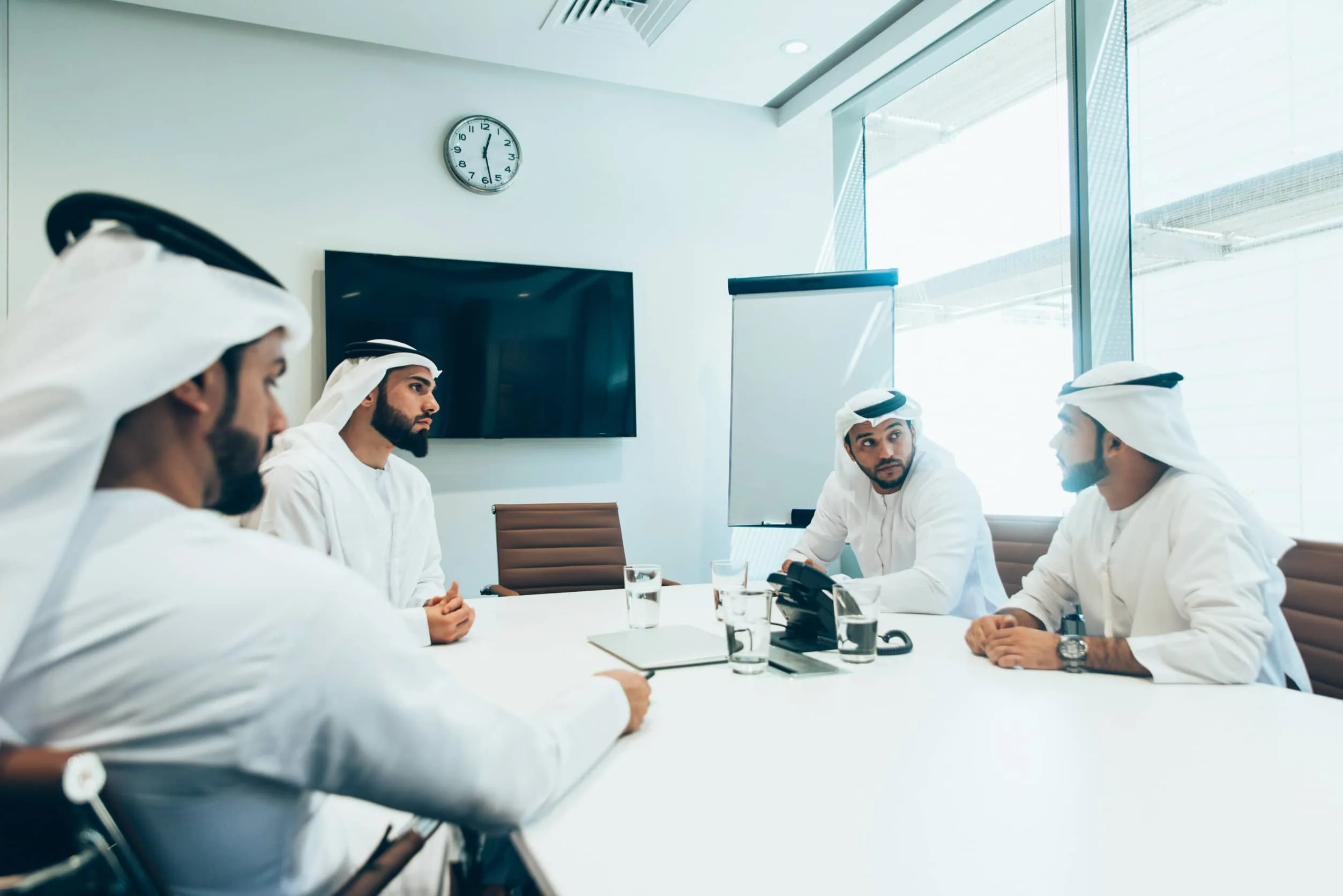 Middle Eastern Businessmen In Meeting Room